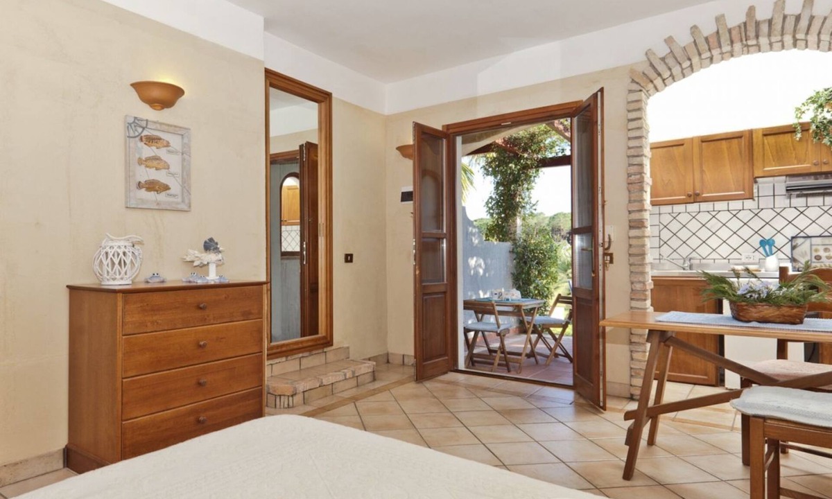 Santa Margherita di Pula Apartment | Studio apartment 2 beds, (20/25 mq): living room with kitchenette, table fridge and double or double bed, bathroom. All studios are located on the ground floor. All the flats have a view of the park. The apartments are equipped with: <b