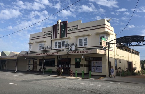 Proserpine Apartment | Clean tidy hotel room with a shared kitchen and shower area