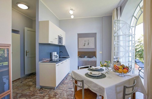 Carciano Apartment | 2-room apartment with terrace and garden in an Art Nouveau villa with communal pool