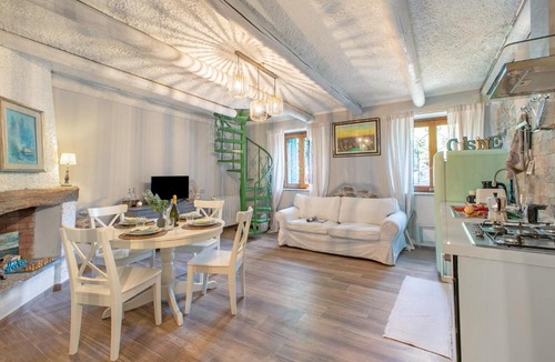 Angera Apartment | Dimora Della Rocca Private Garden - Happy Rentals