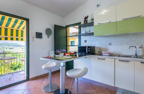 Castellina Marittima Apartment | Lovely apartment for 2 guests with pool, A/C, WIFI, TV, balcony and pets allowed