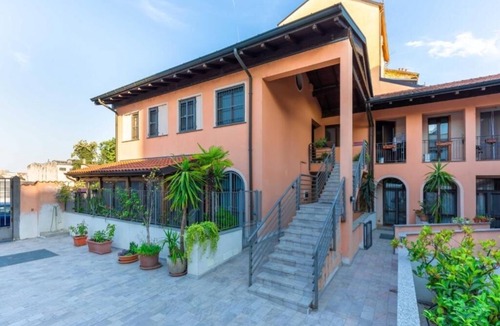Ticinese Apartment | Prada House: Modern Comfort with Terrace and Parking in Milan