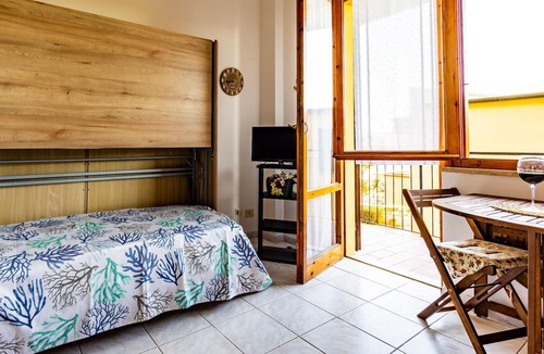 Capoliveri Apartment | Studio Apartment 'Mono Le Lecce 2' with Mountain View, Pool & Balcony