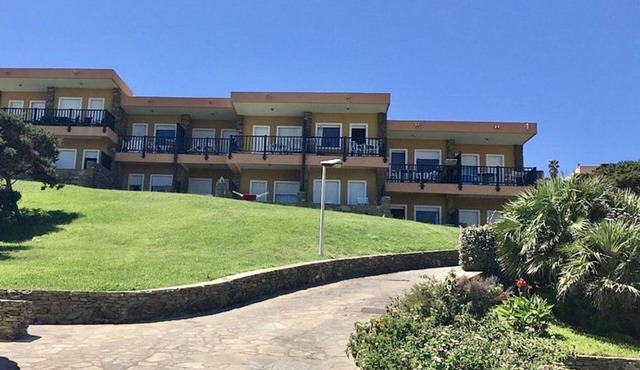 Functional 28 sq m room.Comprising a double bed, two single beds, and a private bathroom with shower, bidet, and hairdryer. The room also features an outdoor space with a sea view, a patio or terrace, and a table and chairs. Breakfast is included in the